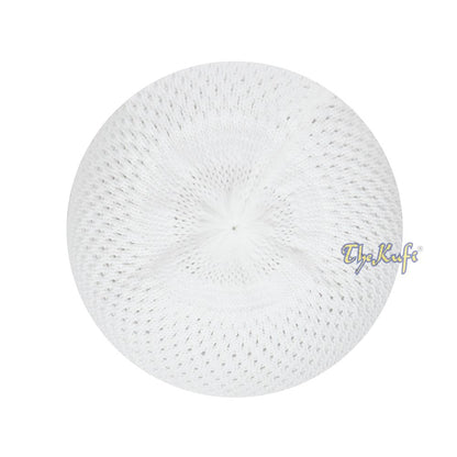 White knitted Islamic prayer cap (kufi) with breathable mesh pattern.