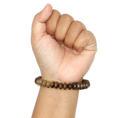 Brown wooden tasbih bracelet with oval textured beads from TheTasbih.com.