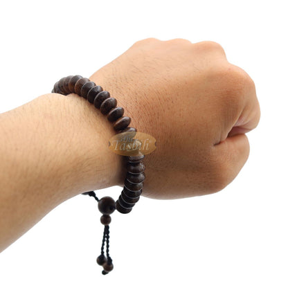 Brown wooden tasbih bracelet with adjustable braided cord.