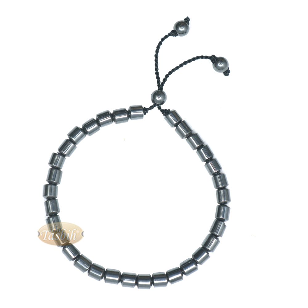 Black cylindrical-bead Islamic tasbih bracelet with adjustable cord.