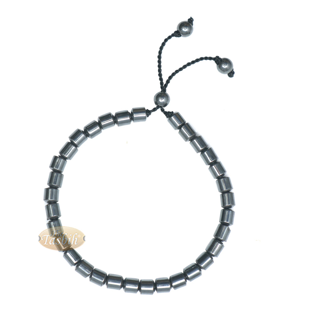 Black cylindrical-bead Islamic tasbih bracelet with adjustable cord.