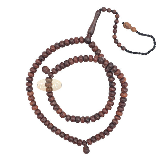 Brown wooden Islamic misbaha with rounded prayer beads and a black tassel cord.