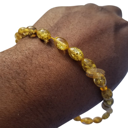 Tasbih Akrilik Oval Kecil 33 Butir Serpihan Daun Berwarna Emas Beraksen 2 Simpul Perak pada Rantai Ekor Rubah