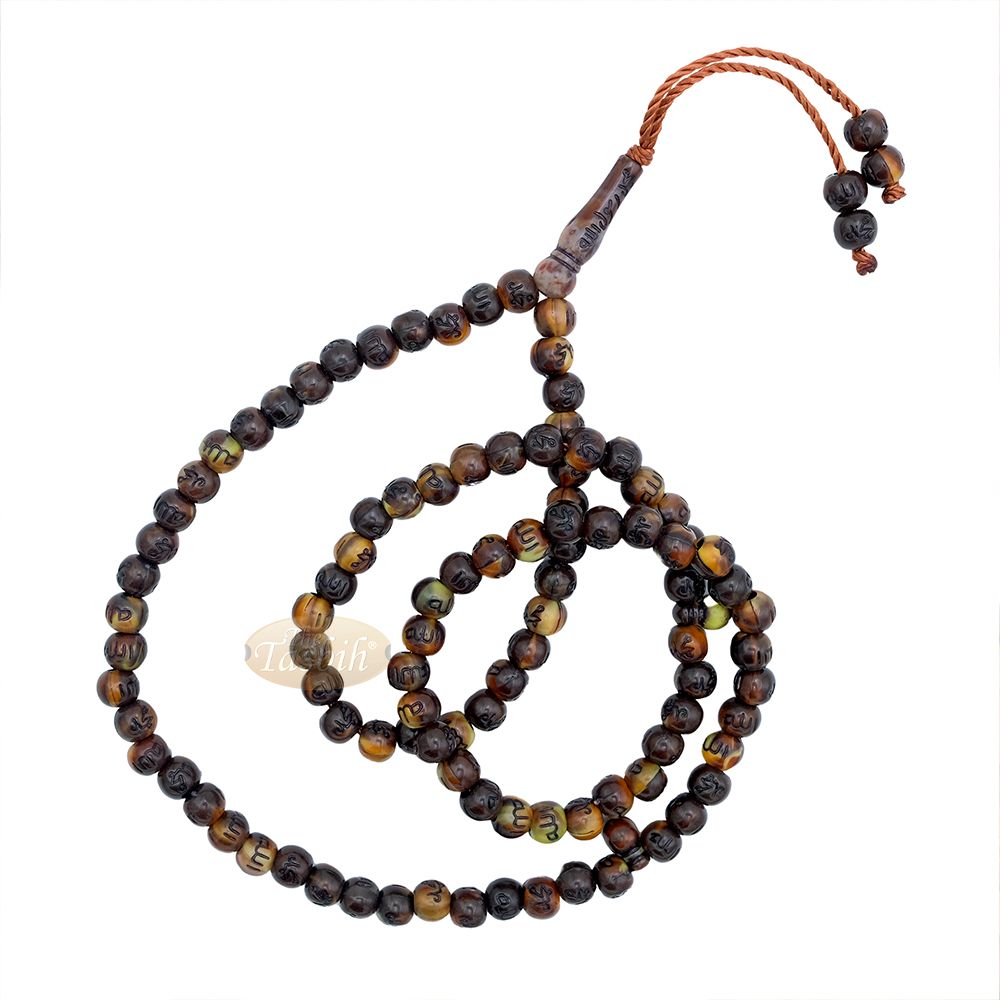 Brown and black patterned wooden Islamic misbaha prayer beads with braided tassel cord.