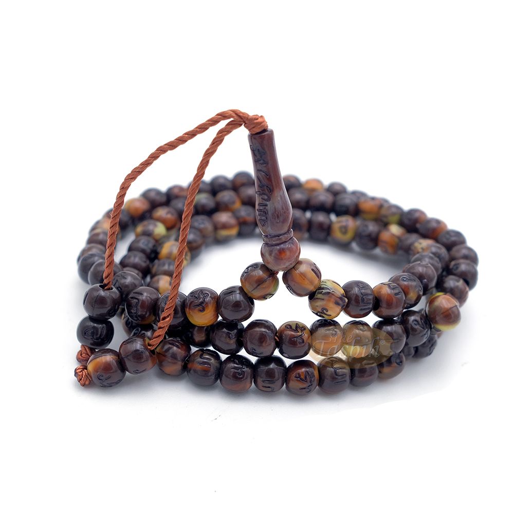 Brown and black patterned wooden Islamic misbaha prayer beads with braided tassel cord.