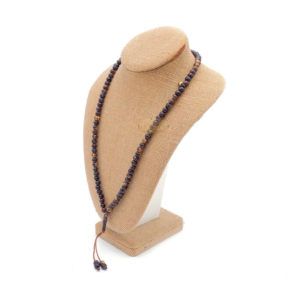 Brown and black patterned wooden Islamic misbaha prayer beads with braided tassel cord.