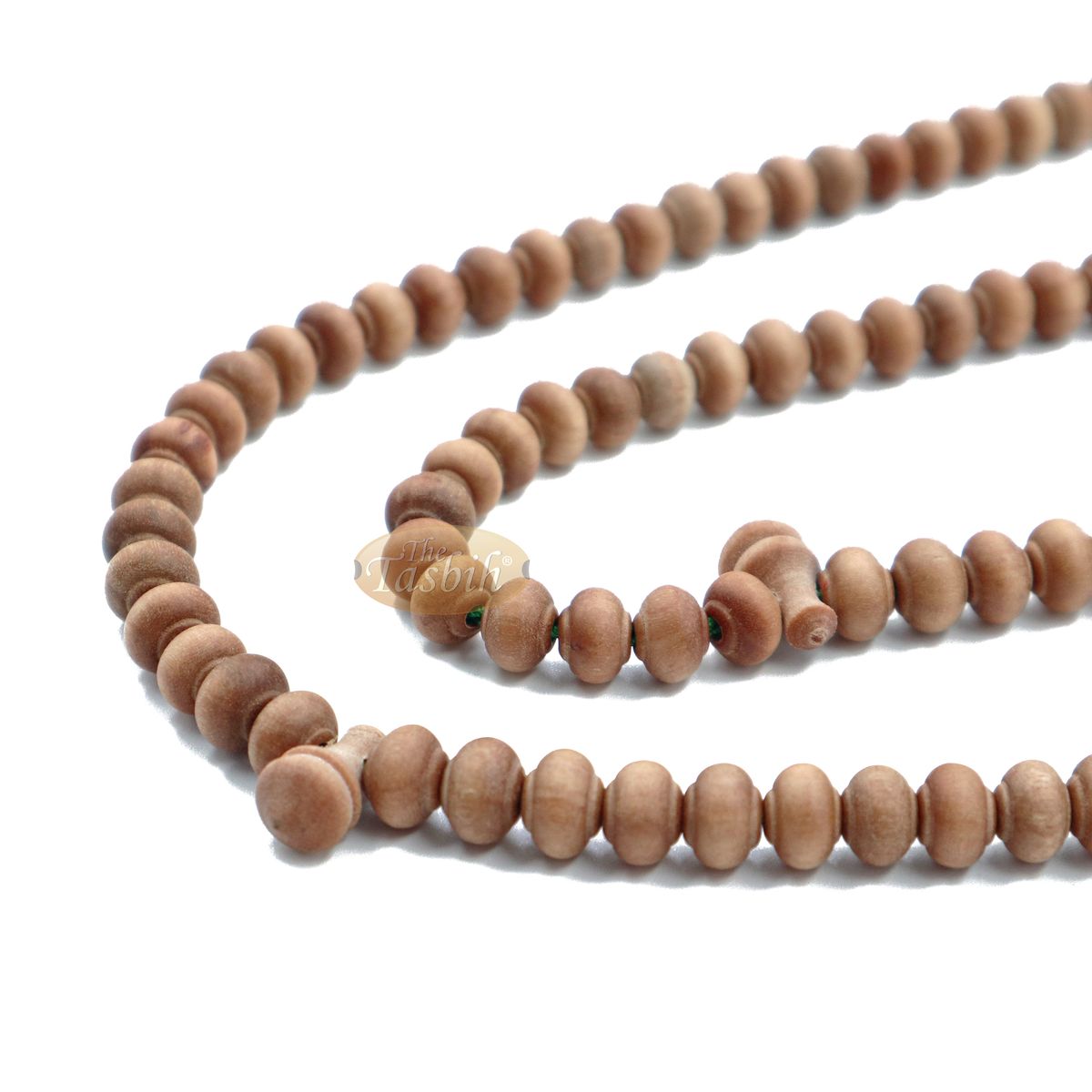 Wooden Islamic misbaha prayer beads with green tassels.